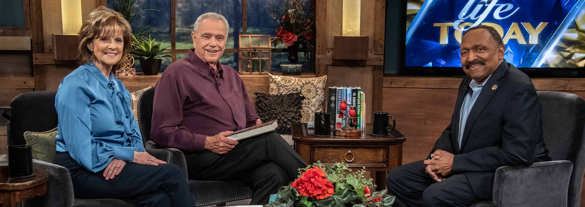 James and Betty Robison, the hosts of LIFE Today, are pictured with their guest, E.W. Jackson, during an episode of the TV show.