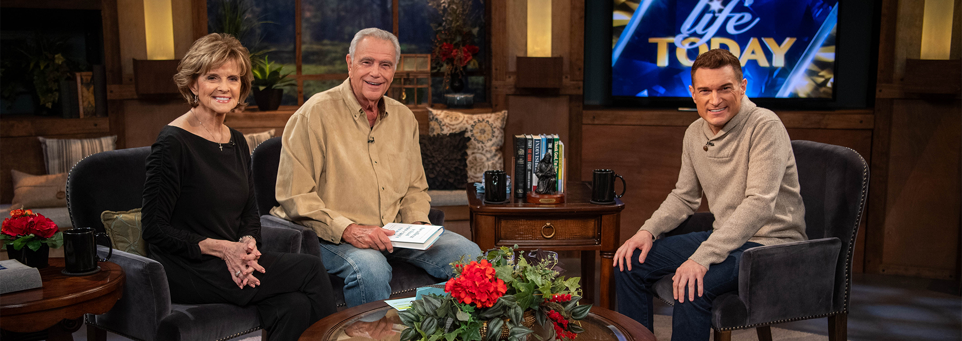 Image of Christopher Cook as a guest on the LIFE Today TV show with hosts James and Betty Robison. Christopher is seated to the side of James and Betty. All three are looking at the camera and smiling warmly.